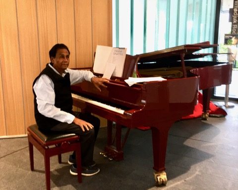 Arthur Gracias at his piano